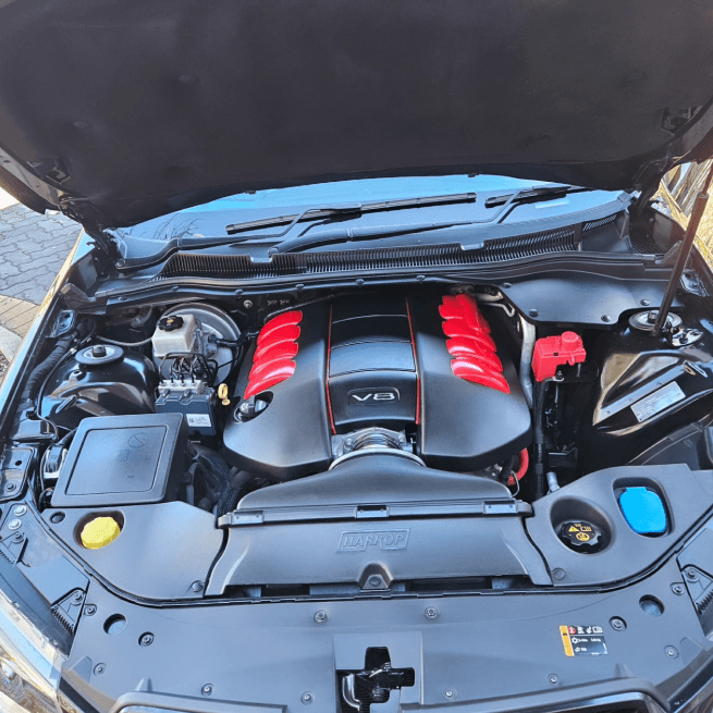 V8 engine bay inspected during a major service