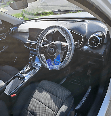 Detailed car interior with a protected steering wheel