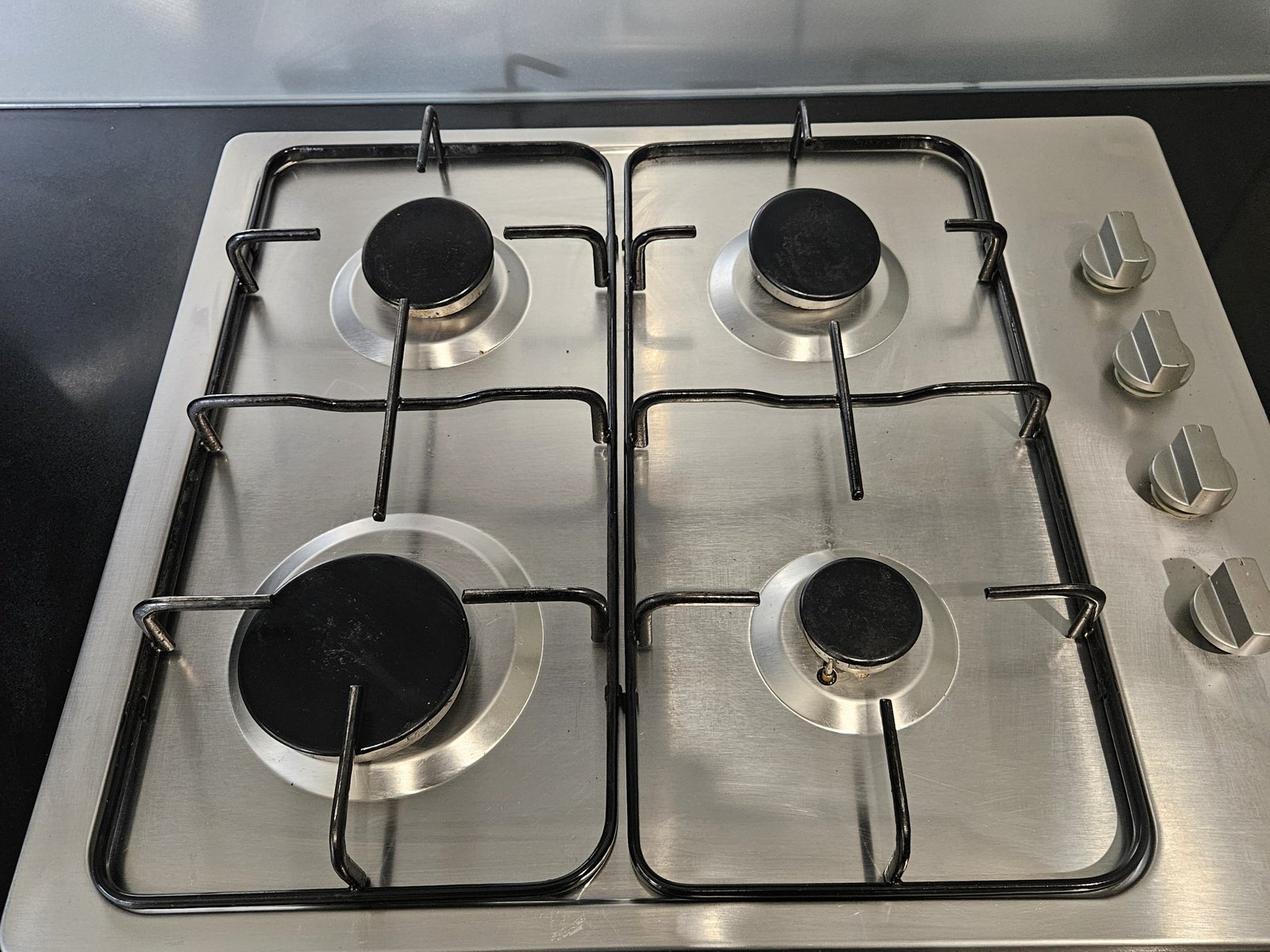 Stainless cooktop after degrease and polish