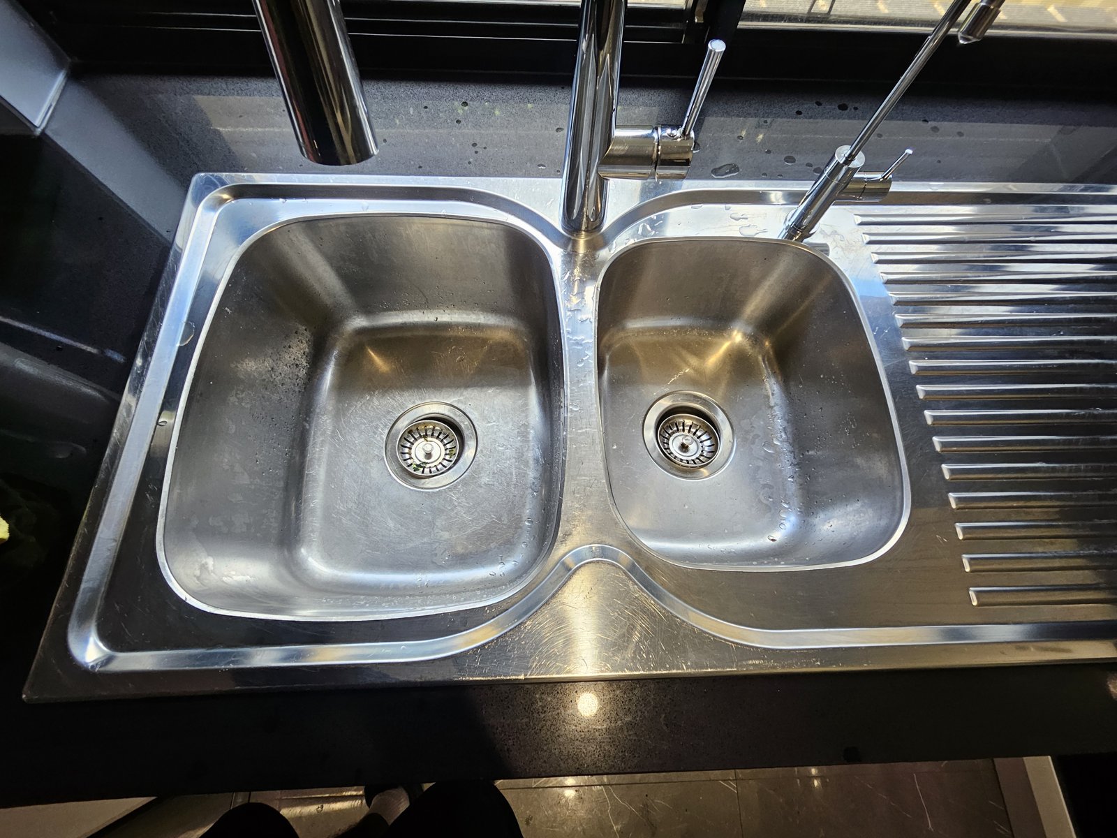 Stainless kitchen sink after polish