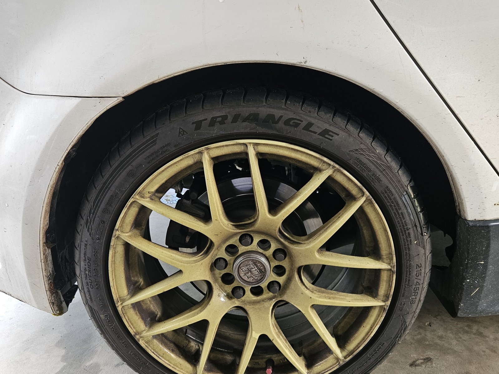Brake-dust covered alloy wheel before cleaning
