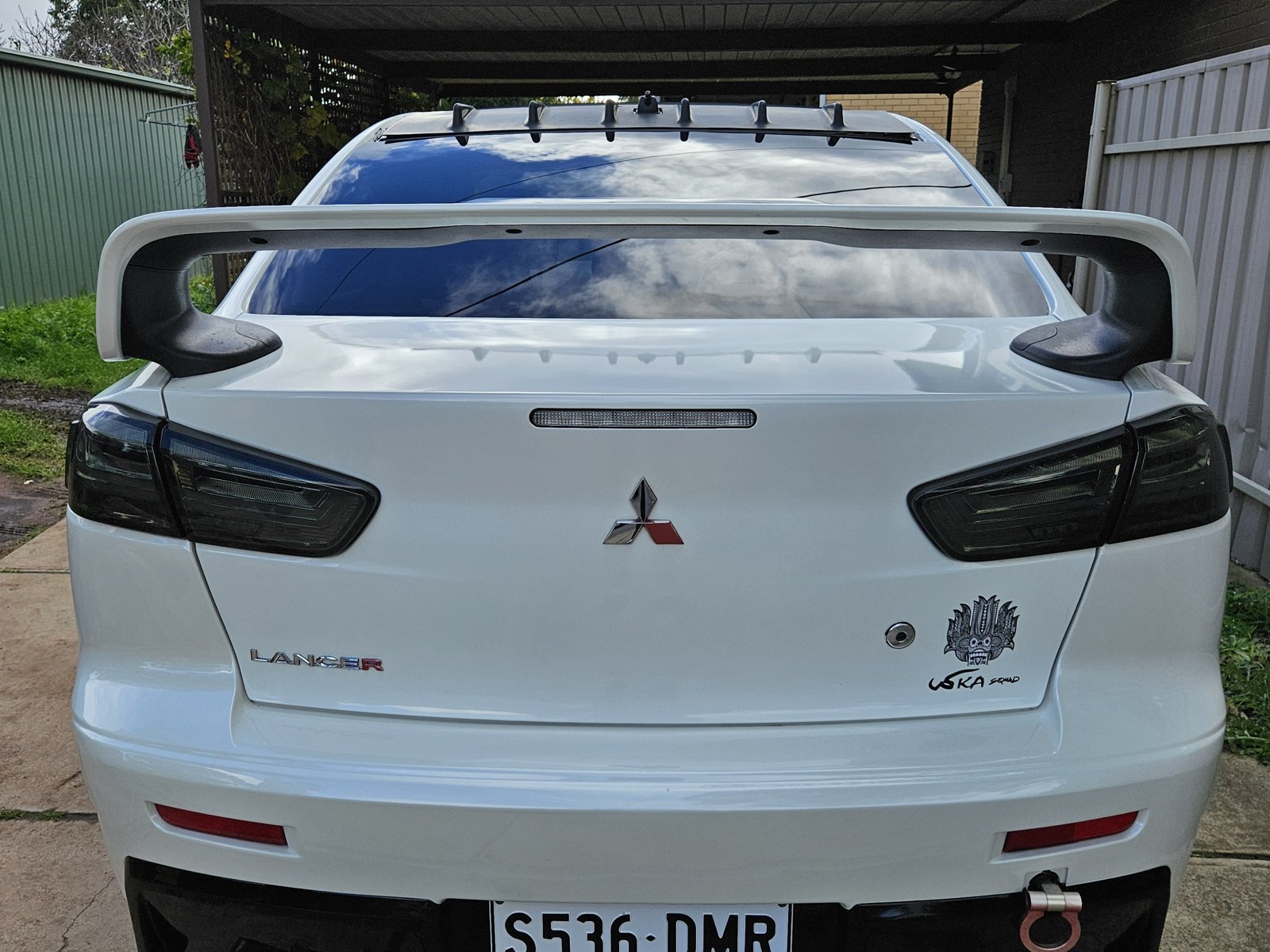 Sedan rear panel gleaming after wash and polish