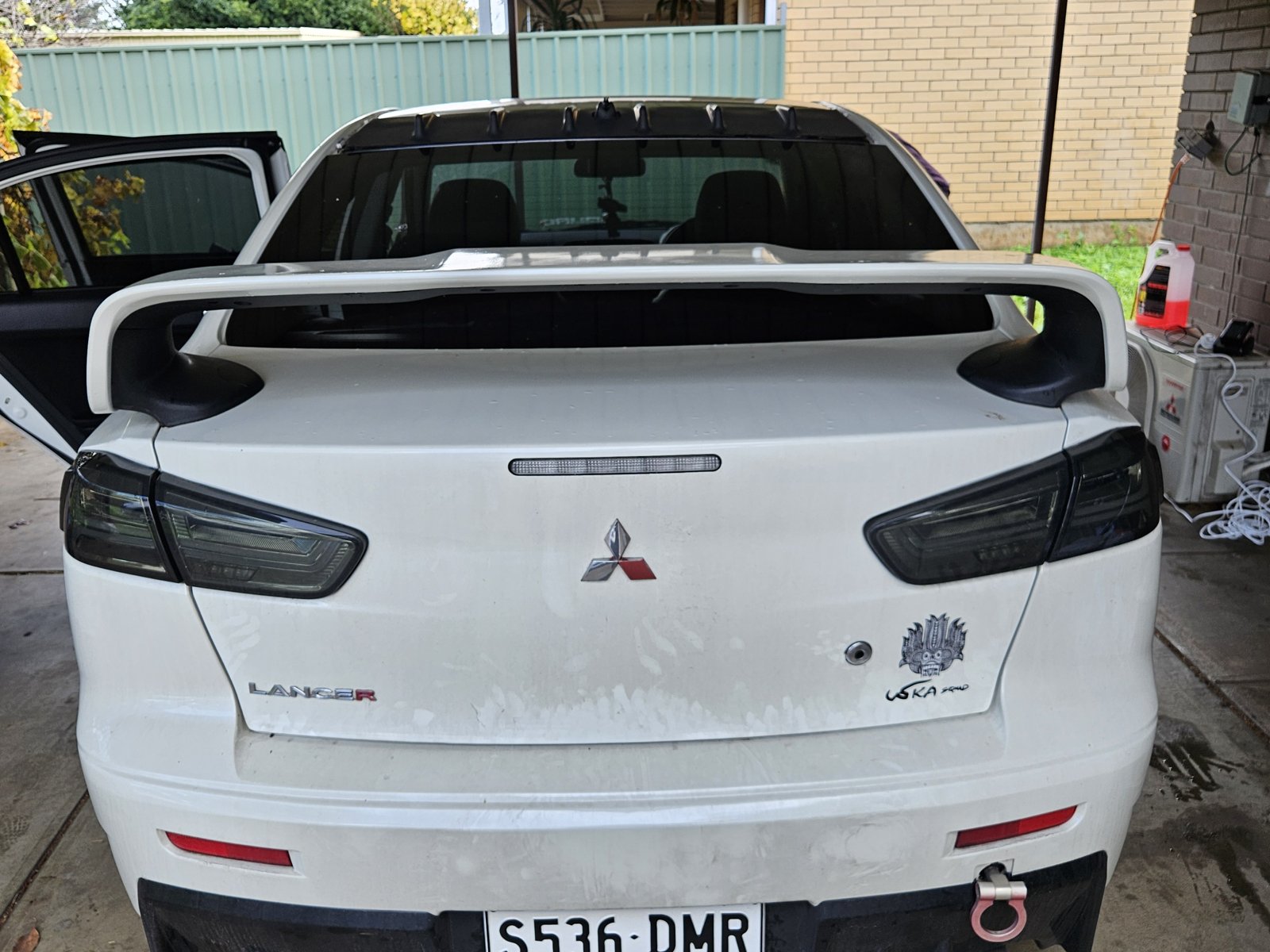 Dirty sedan rear panel before washing