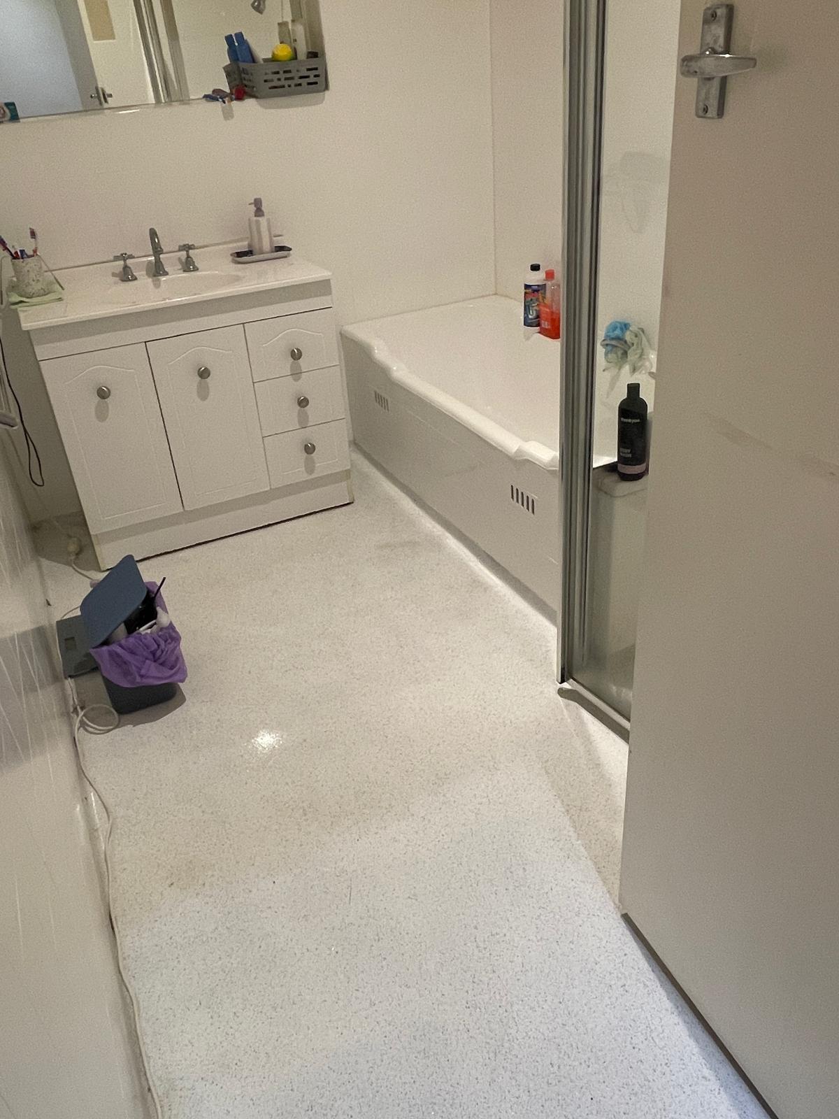 Bathroom vanity and bathtub cleaned