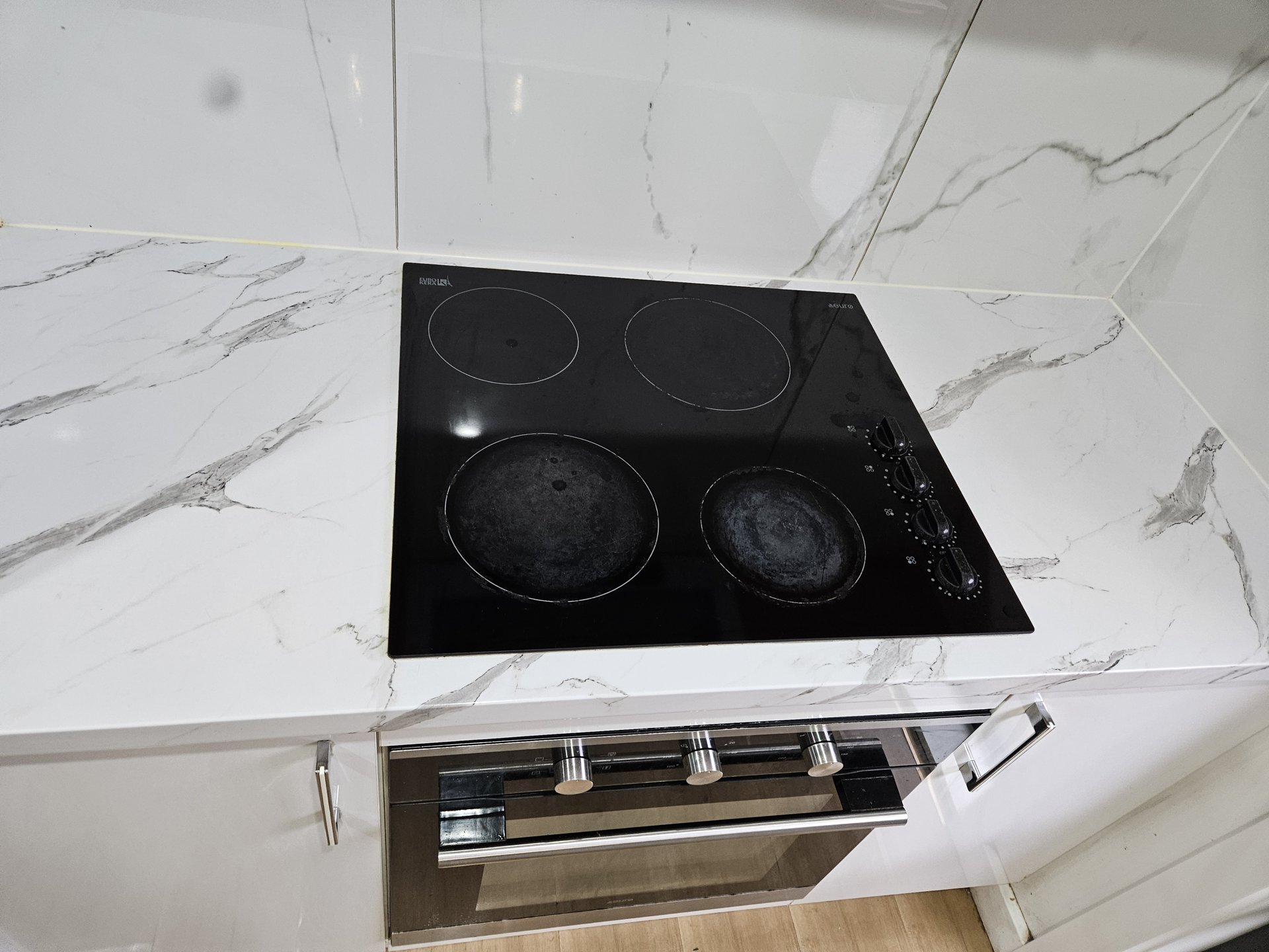 Induction cooktop and oven cleaned to a shine