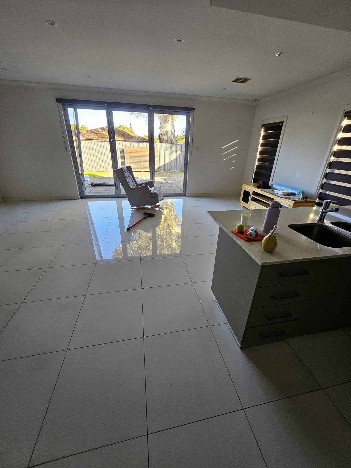 Living area with sparkling tiled floor after cleaning